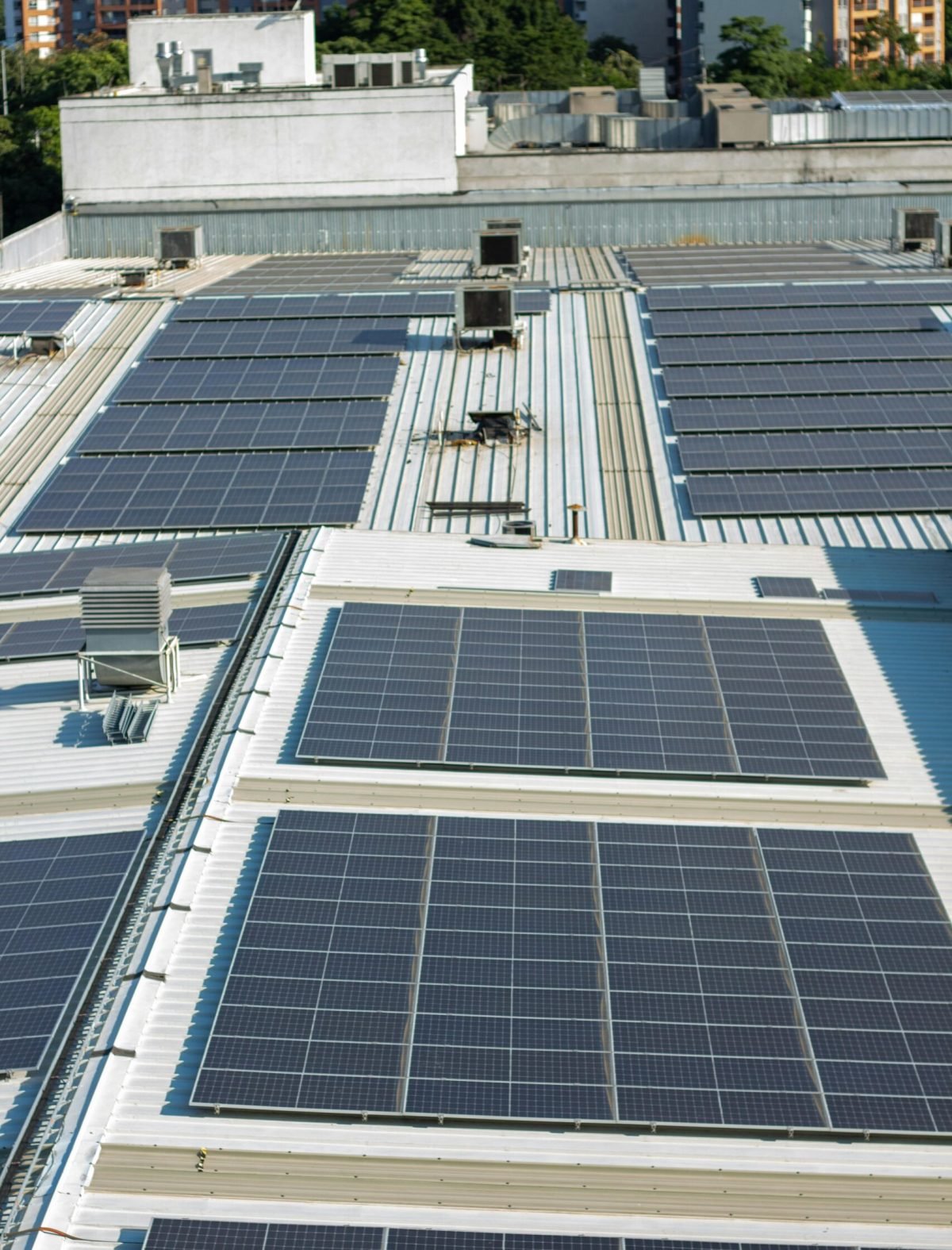 Aerial view of solar panels on an urban rooftop in Valle del Cauca, Colombia.